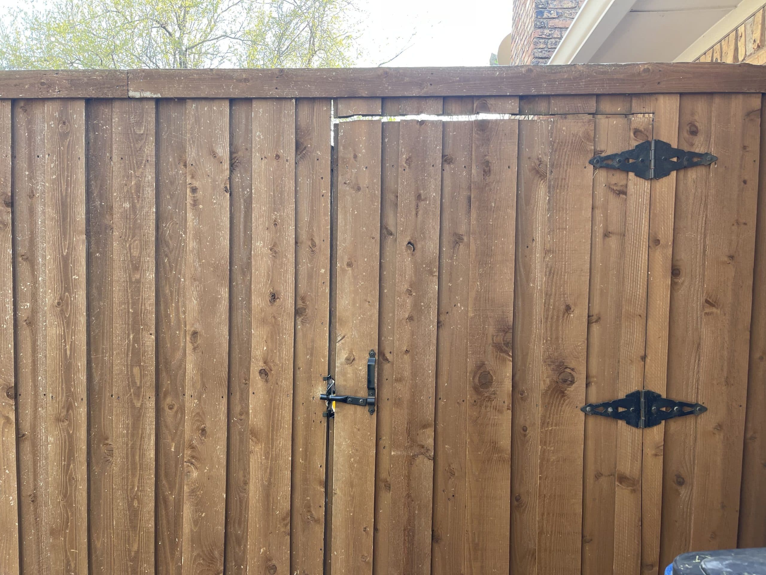 Hail damage to wood fence 2